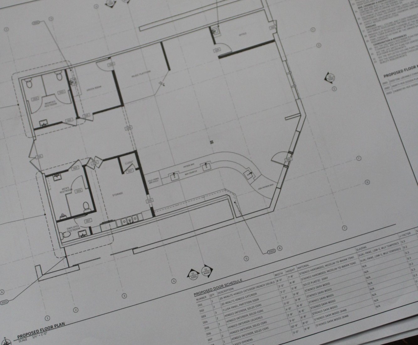 Close view of a printed proposed floor plan sheet from a construction document set